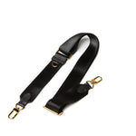 Sidecar black sable nylon purse strap, featuring a smooth durable design, gold accents, and adjustable length for bags.