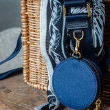 Sidecar indigo blue nylon purse strap, featuring a smooth durable design, gold accents, and adjustable length for bags. Matching indigo blue round coin purse with gold accents. Hands-free, secure carry.
