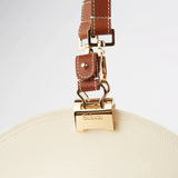 Sidecar The OG 14K gold hat clip with genuine brown leather side strap, white stitching, and adjustable leather strap with 14k hardware. Luxury, hands-free hat carry worn in 4 styles: Crossbody, Backpack, Purse-style, and Waist-wear.