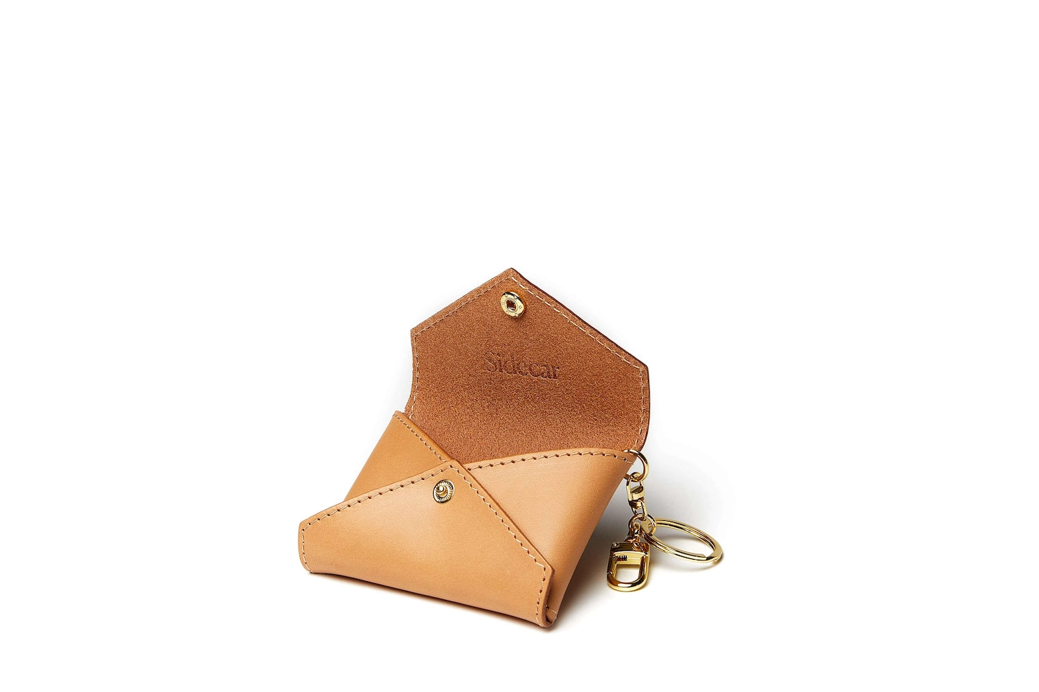 Sidecar brown ID envelope with premium leather finish and snap closure, designed to securely hold identification and small essentials.