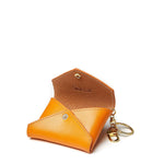 Sidecar carrot brown ID envelope with premium leather finish and snap closure, designed to securely hold identification and small essentials.