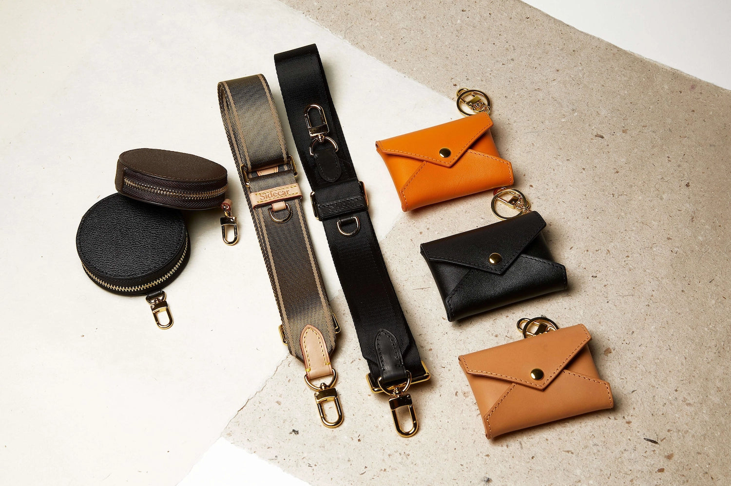 Sidecar ID envelopes with premium leather finish and snap closure, designed to securely hold identification and small essentials. Sidecar black and olive coin purse. Sidecar black and olive nylon purse straps. Hands-free carry, worry-free carry.