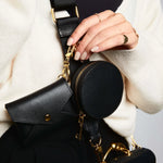 Sidecar Black ID envelope with premium leather finish and snap closure, designed to securely hold identification and small essentials.