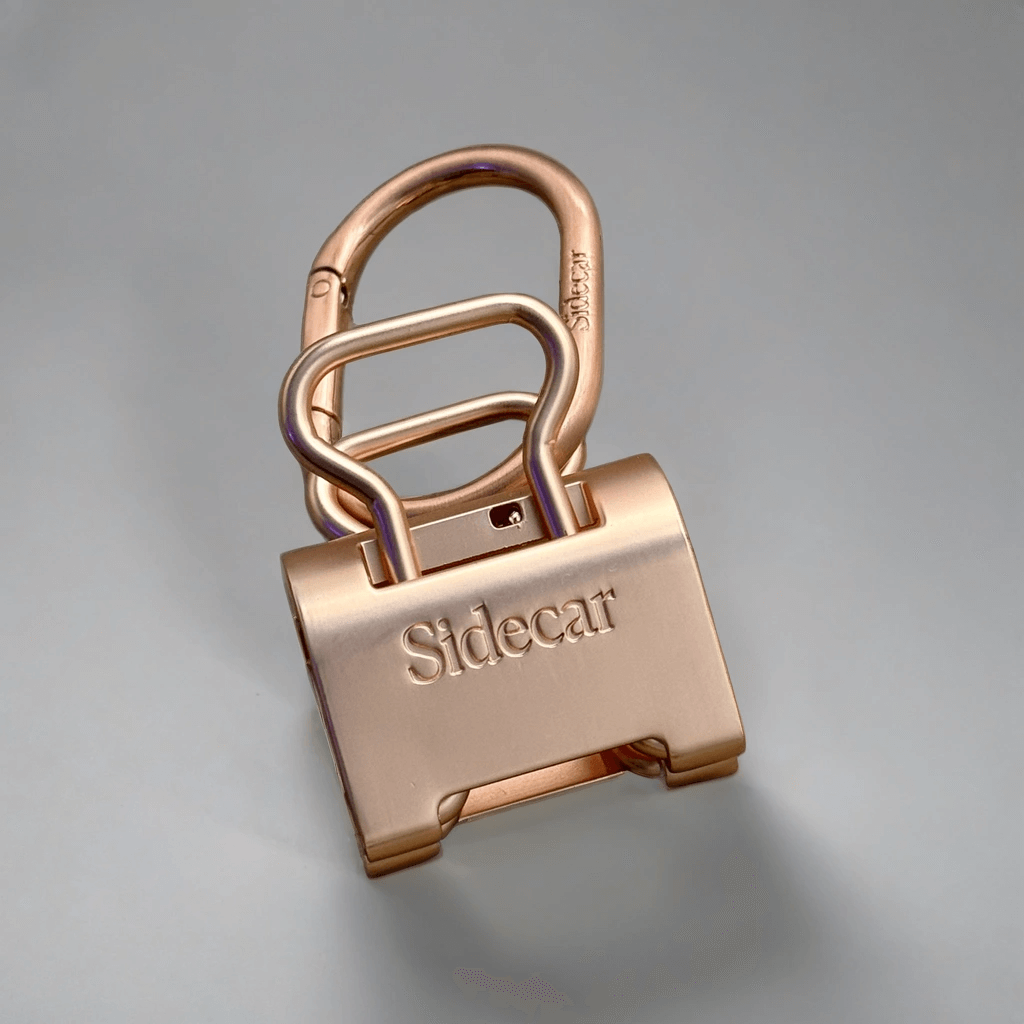 Sidecar Brushed Rose Gold Duo Set. Close-up of oval hinge clasp and patented hat-safe tension system. Sidecar Duo Set.