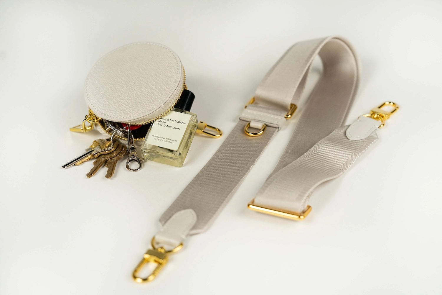 Sidecar stone nylon purse strap replacement with matching coin purse, featuring a smooth design, gold accents, and adjustable length for bags.
