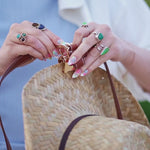 Crossbody Style: Sidecar The OG 14K gold hat clip with genuine brown leather side strap, white stitching, and adjustable leather strap with 14k hardware. Luxury, hands-free hat carry worn in 4 styles: Crossbody, Backpack, Purse-style, and Waist-wear.